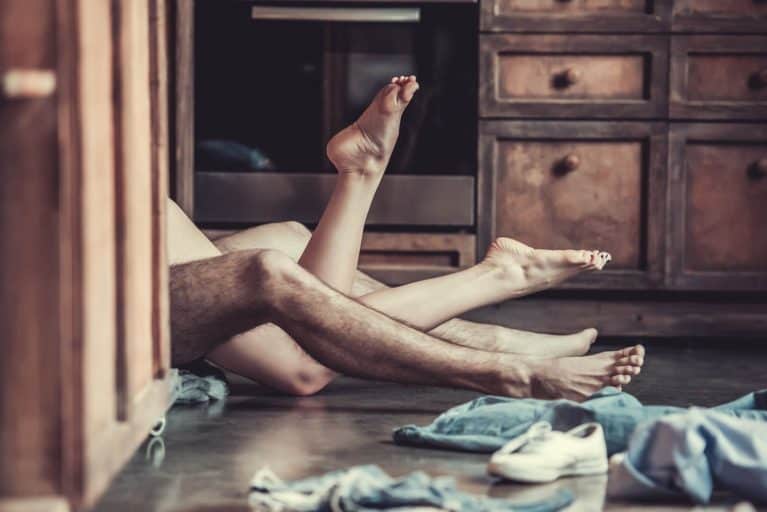 Couple having sex on the ground