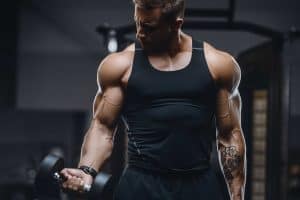Muscles in man lifting weights