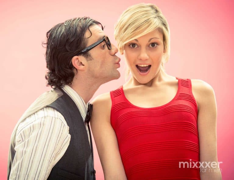 Man awkwardly kissing a pretty girl
