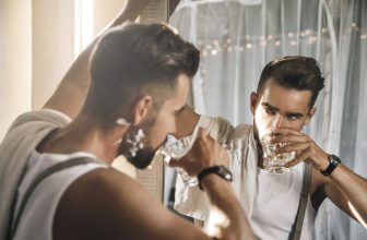 An autosexual man admiring himself in the mirror
