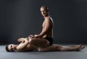 A sexy couple practicing Kama Sutra